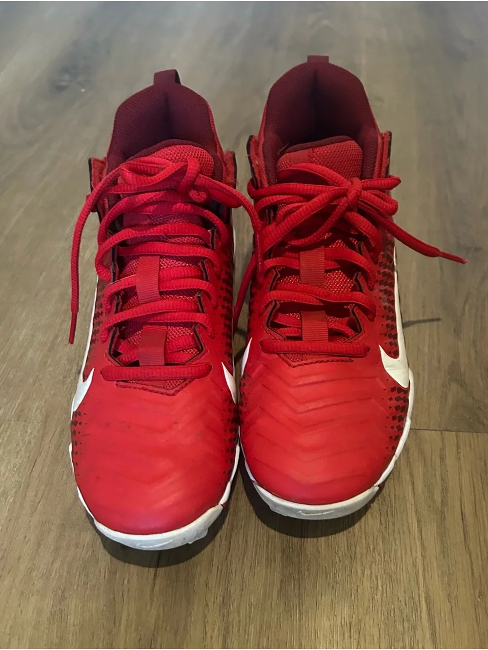 Kids' Red Cleats with White Swoosh